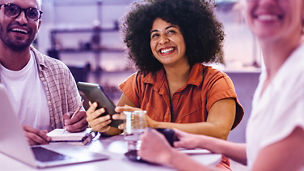 Remote business team using a work lunch to brainstorm and collaborate on ideas over coffee.