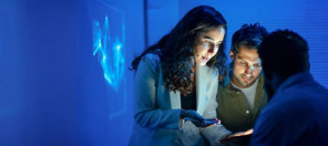 Colleagues looking together on tablet