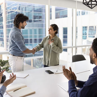 Colleagues shaking hands at work