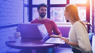 Colleagues working together in cafe