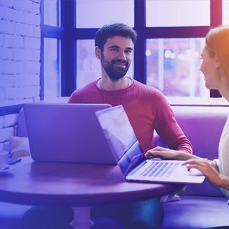 Colleagues working together in cafe