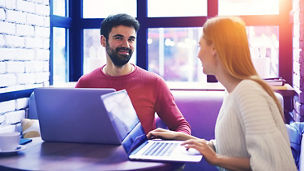 colleagues working together in a cafe