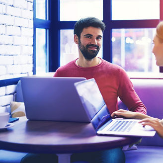 colleagues working together in a cafe