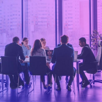colleagues having a meeting at the table