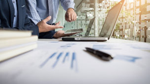 Business adviser analyzing financial figures denoting the progress in the work of the company.