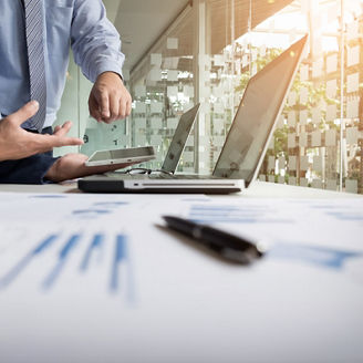 Business adviser analyzing financial figures denoting the progress in the work of the company.