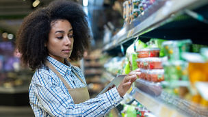 Girl looking at boxes in store