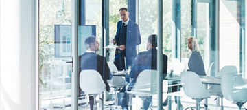 Full length shot of a group of corporate businesspeople meeting in the boardroom