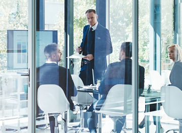 Full length shot of a group of corporate businesspeople meeting in the boardroom