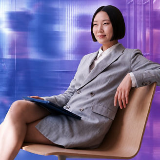 Corporate woman sitting on chair