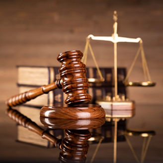 Justice legal and jurisprudence concept. Law books on lawyer desk at law firm.