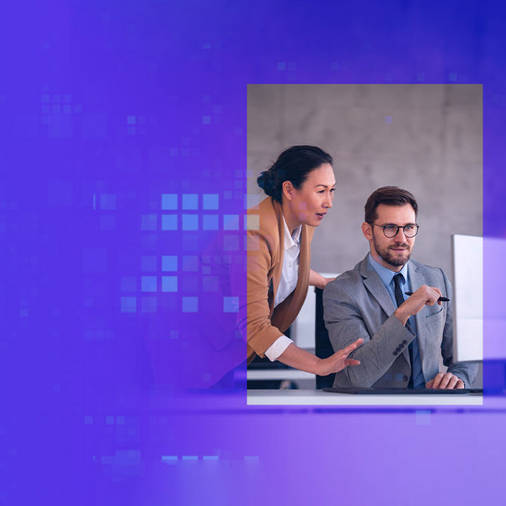 Coworkers working together on desktop