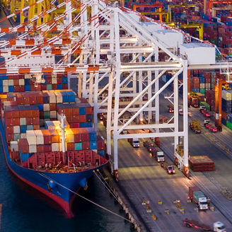 crane loading cargo container from truck to container ship in the international terminal logistic sea port concept freight shipping by ship. industry transportaion