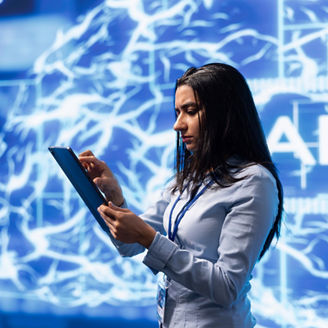 Computer scientist using artificial intelligence computing simulating human brain thought processes. Indian employee working on tablet, developing AI machine learning algorithms