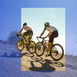 Cyclists on a uphill track banner