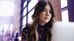 Focused businesswoman working at laptop; Shutterstock ID 2216468795; purchase_order: advisory assurance marketing; job: anne; client: ai-hub