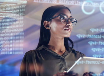 Businesswoman holding a tablet, futuristic screen