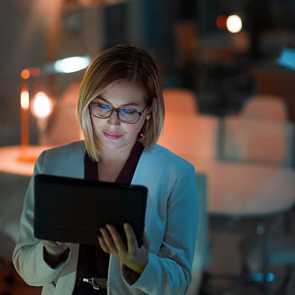 Business woman, tablet and typing in office for corporate communication, internet research and networking. Female person, technology and working late night for project planning and email conversation.