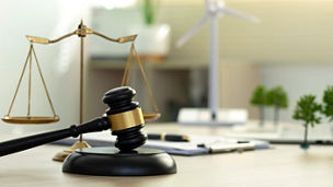 Environment Law.Gavel with scales of justice on environmental. law for principles of sustainable environmental conservation. law implement clean and sustainable energy with net zero regulation.ESG