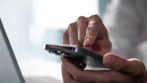 Close up of business man hand using smart phone and tablet. business and technology concept.