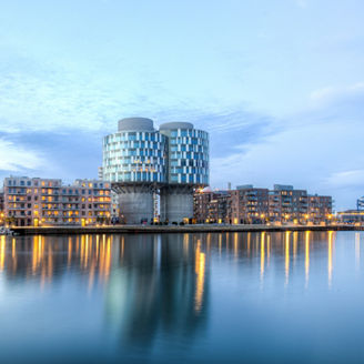 Copenhagen, Denmark - March 12, 2017: Evening view of the Portland Towers, two silos converted into office bildings in the Nordhavn district.