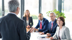 Business man giving a presentationhttp://bit.ly/1baBzlj