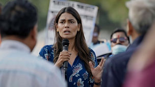 Indian woman politician giving a speech at a rally