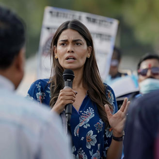 Indian woman politician giving a speech at a rally