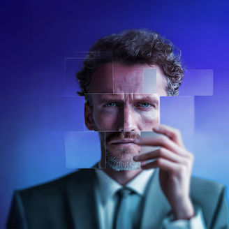 A man against a purple background