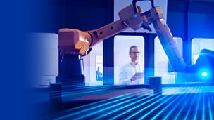 Engineer examining surveying robot through glass window of laboratory