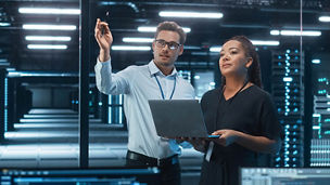 Engineers in server room