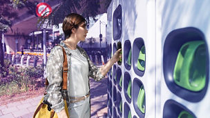 woman grabbing something from the wall