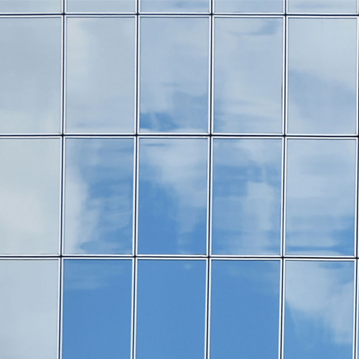 Glass façade and clouds