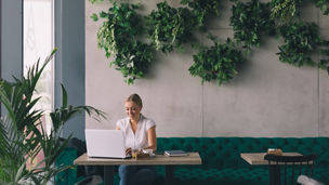 She has a busy coffee break.Woman  working on laptop in cafe bar; Shutterstock ID 432260389; purchase_order: Marketing AdvAss; job: Evy Brans; client: ESG Services Update