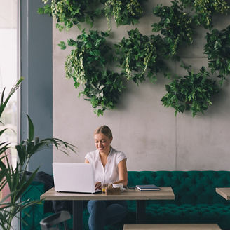 She has a busy coffee break.Woman  working on laptop in cafe bar; Shutterstock ID 432260389; purchase_order: Marketing AdvAss; job: Evy Brans; client: ESG Services Update