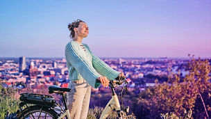 woman with a bike in town