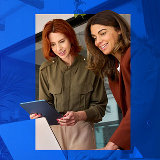 Two women looking at a tablet
