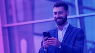 A man in the street smiling