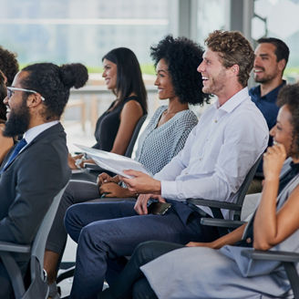 Corporate, development and seminar with business people in conference room for learning or training. Education, event or workshop with man and woman employee group in audience or crowd at office.