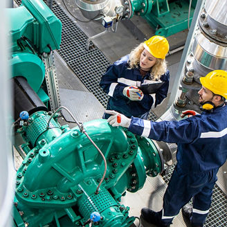 Factory workers having conversation