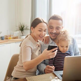 Family looking at laptop