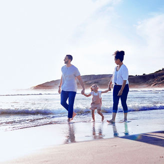 family walking near beach