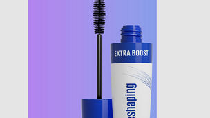 Bottle of mascara with an open lid