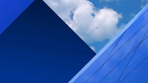 Federal Budget 2026 hero static – blue sky with clouds reflected in building windows