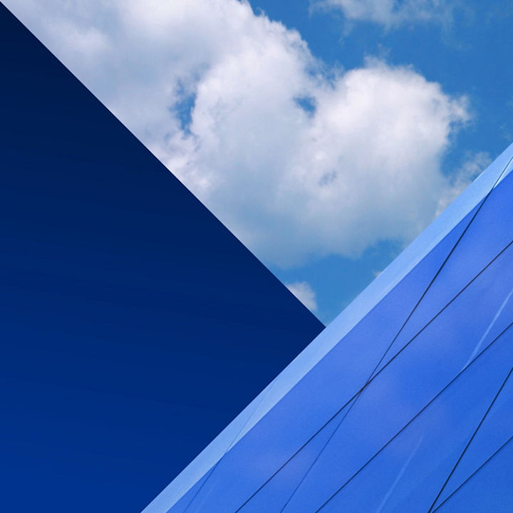 Federal Budget 2026 hero static – blue sky with clouds reflected in building windows