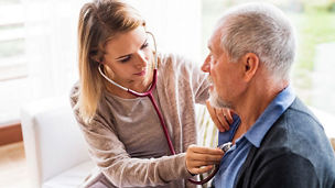 Female doctor with elderly patient