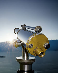 Remote telescope in front of mountains