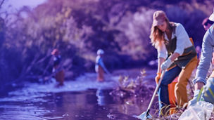 Few people cleaning a river banner