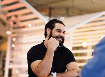 Man sitting at table meeting with woman