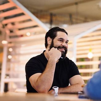 Man sitting at table meeting with woman